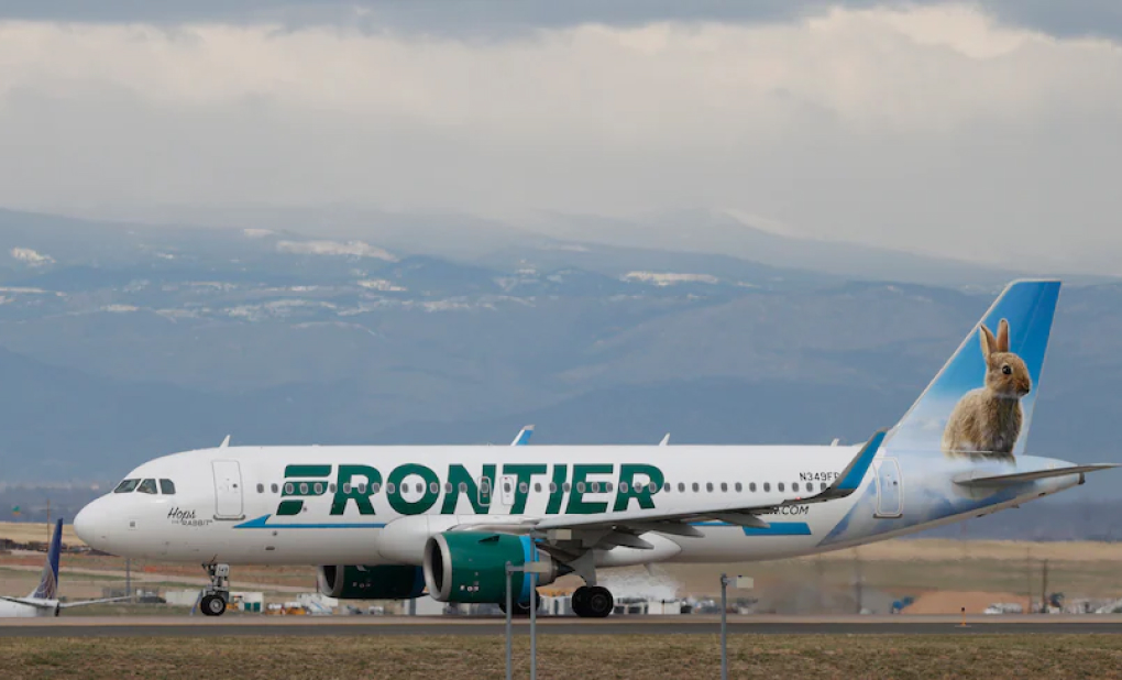 A Frontier Airlines jetliner taxis to a runway to take off from Denver International Airport. (David Zalubowski/AP)